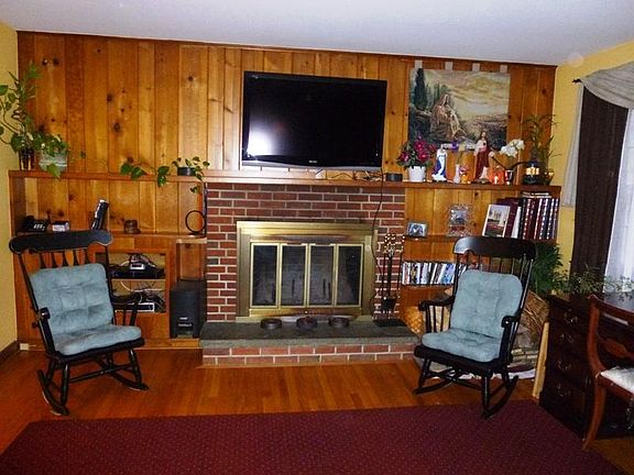 Living room with Custom Masonry
        Fireplace