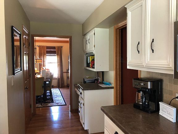 additional view of Kitchen,pantry door is on the left, desk