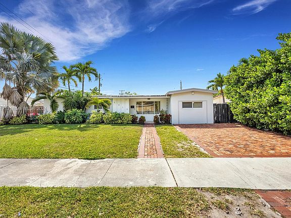 Updated interior with beautiful large tiled flooring throughout. Three full bathrooms.