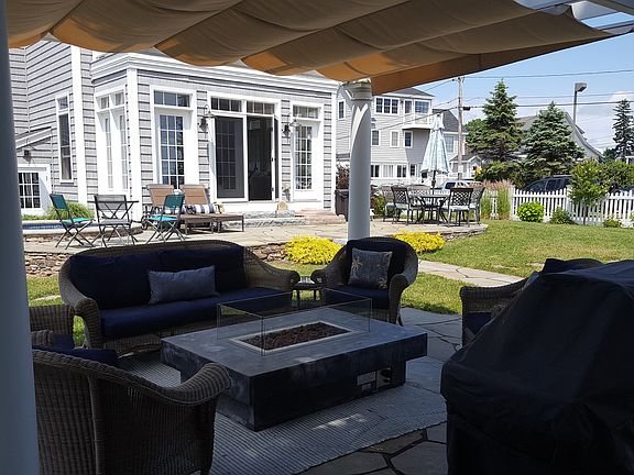 side view of house with outdoor fireplace