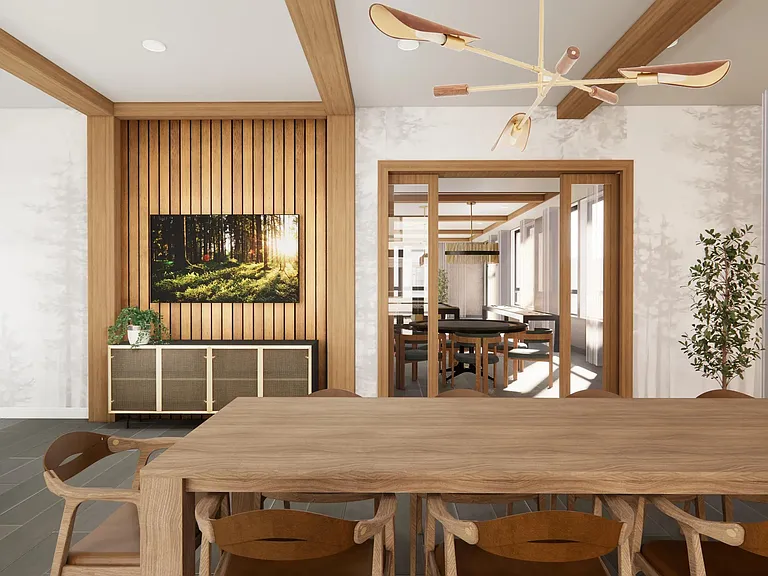 The game room lounge at Modera Bridle Trails offers cozy seating and warm wood tones, creating a comfortable place to relax and unwind.
