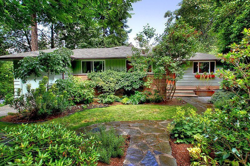 Quiet in-city retreat in Maple Leaf. This turn-key mid-century home lives like a treehouse with lovely light & views from every beautiful new window. 3 beds on main, gleaming hardwood floors and spacious, finished basement w/ 4th bed & large office. Generous deck overlooks a tranquil greenbelt and the Cascades. Updates include new kitchen appliances, gorgeous venetian plaster counters & floor and professional organic landscaping. Pride of ownership throughout. Easy access to I-5 and downtown.