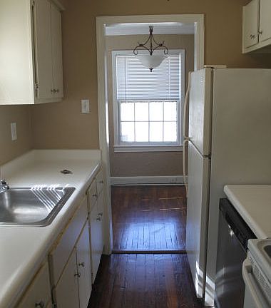 Galley Kitchen with hardwood floors