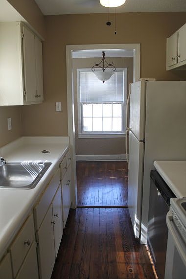 Galley Kitchen with hardwood floors
