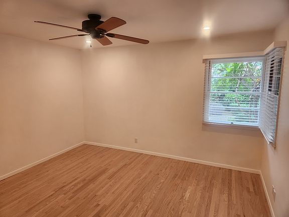 Primary bedroom with bright corner windows