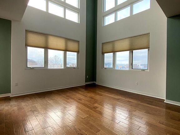 Corner unit with extra set of windows. Open two-floor ceiling letting in lots of natural light.