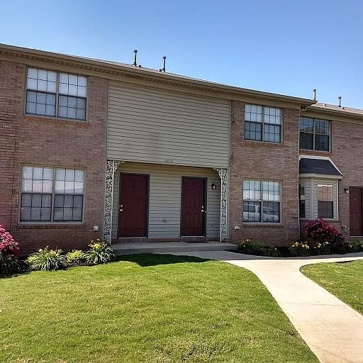 Front view with beautiful lawns and gorgeous roses