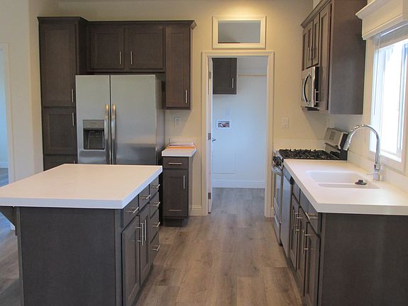 Kitchen area. Refrigerator, dishwasher, microwave oven all included.