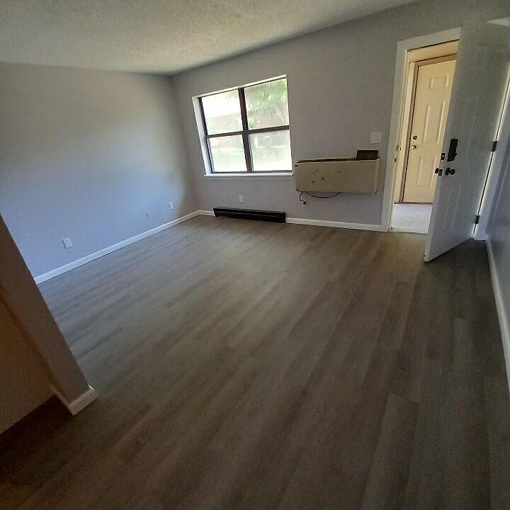Living Room with storage just outside the front door
