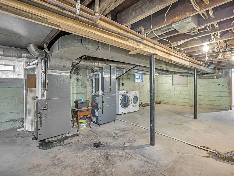 Clean basement with laundry and access to the third bedroom