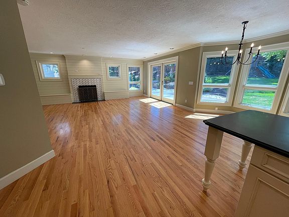 Family room with gas fireplace and double doors to back yard.