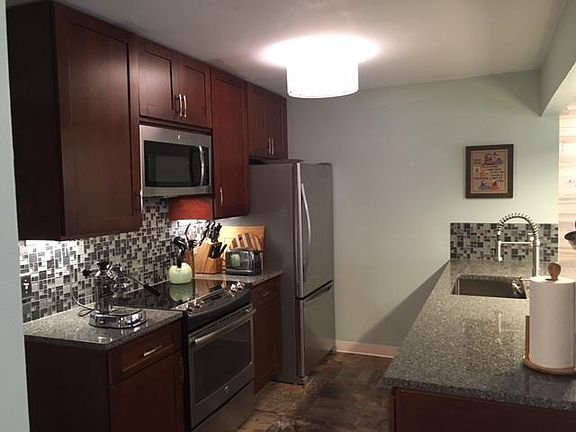 Fully stocked kitchen with stainless steel appliances