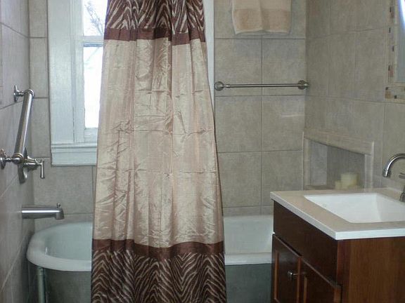 Brand new dreamy decorative ceramic tiled bathroom, Moen bru