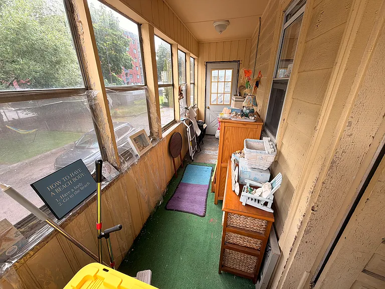 Enclosed Back Porch/Back Yard Area