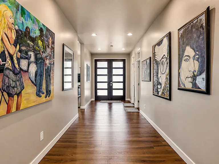 Art Gallery Entry way and Exit. Front double doors are identical to rear doors which lead to sauna and rear yard 1.2 acres of serenity