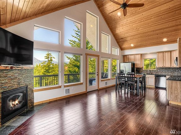 High-end finishes throughout with hardwood floors, knotty pine accents, recessed lighting and gas fireplace with stone surround.