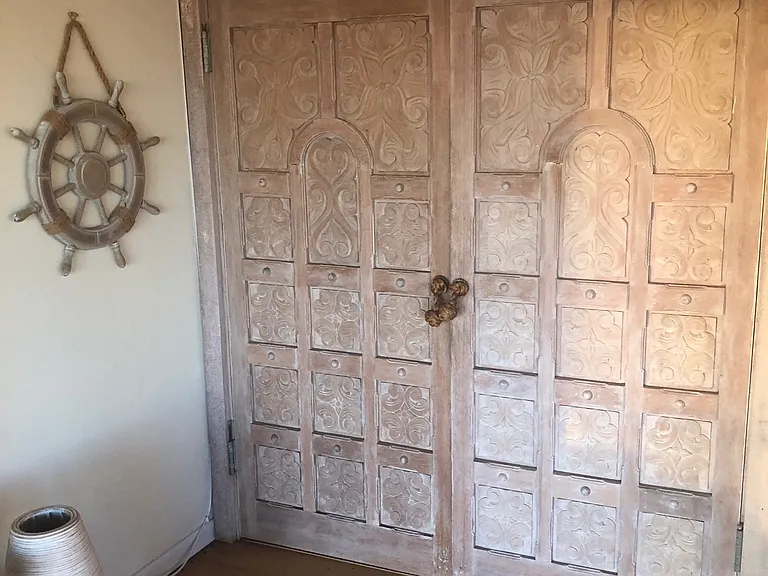 Hallway to great room doors were hand carved in Mexico-all doors were hand made for the house