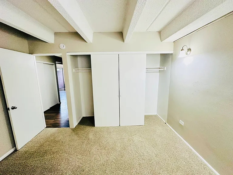 Explore the comfort of this cozy bedroom featuring ample storage and stylish design. Explore the comfort of this cozy bedroom featuring ample storage and stylish design.