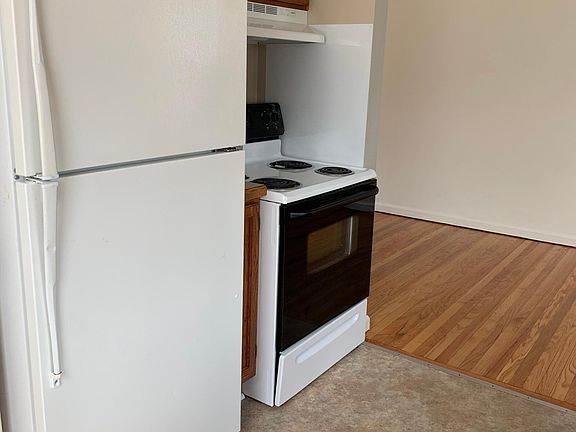 Refrigerator and self cleaning electric stove