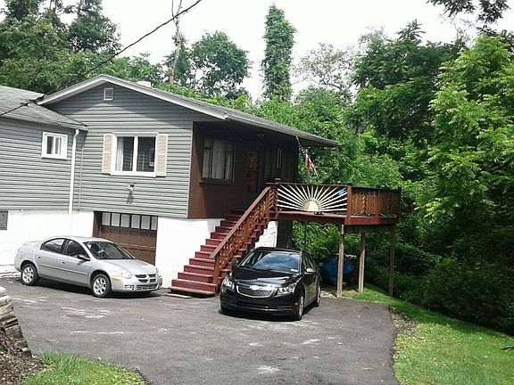 Integral heated garage. Multiple car driveway, Deck with under storage for wood and ride on mower.