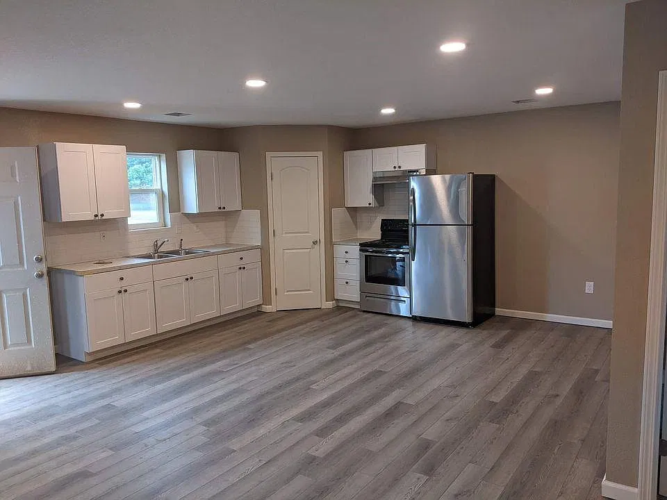 Pantry in corner. Newer fridge and range. Open floor plan