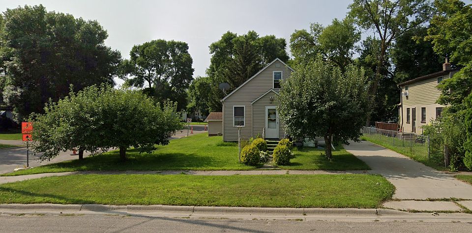 This is the front of the house, very long driveway on the right, apple trees in the front