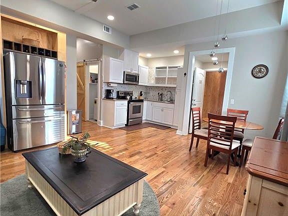 another view of living area including the fully equipped kitchen