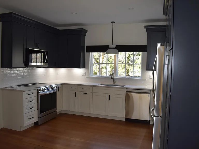 Kitchen for Unit 1. Stove and Range are electric. Microwave, Dishwasher and Fridge included, no garbage disposal.
