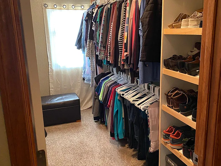 3x sized walk-on closet with many shelves and shoe racks