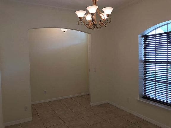 Dining room with real cherry wood blinds.