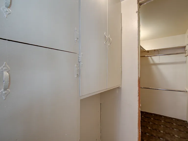 WALK IN CLOSET 8 X5 CLOSET AND LOTS OF CABINET SPACE BEFORE YOU ENTER TO LEFT. ACROSS FROM LAUNDRY ROOM