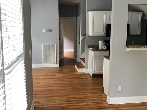 B unit Entry view, LR on right, Kitchen beyond LR, Dining area to left of Kitchen.