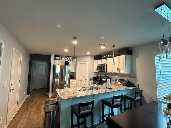 Front door and kitchen