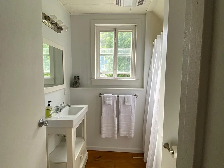 Upstairs Bathroom - contains sink, toilet, and shower.