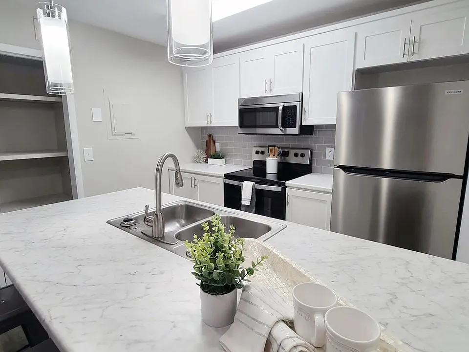Kitchens that sparkle with marble-style countertops, wood-style flooring, and stainless-steel magic.