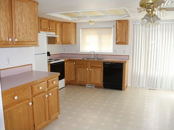Large Open Kitchen With New Refrigerater