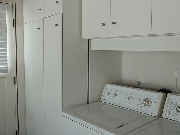 laundry &finished garage w/storage cabinets