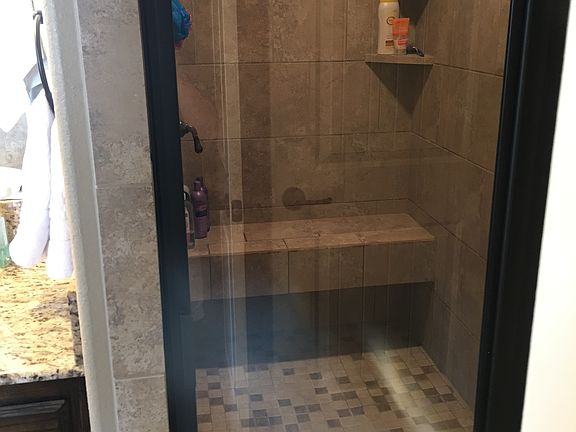Large Master shower w/ bench