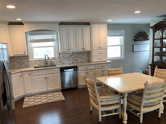 look how beautiful these custom cabinets are, and notice the appliance garage!
