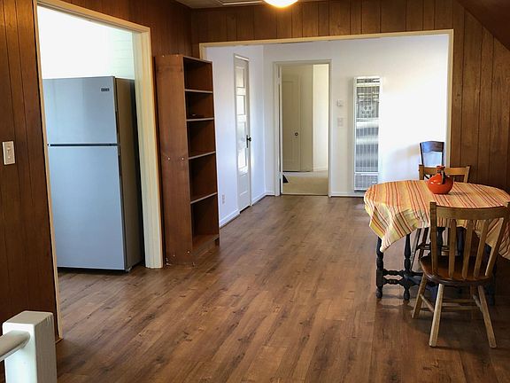 View from entrance; eating area on right, kitchen on left