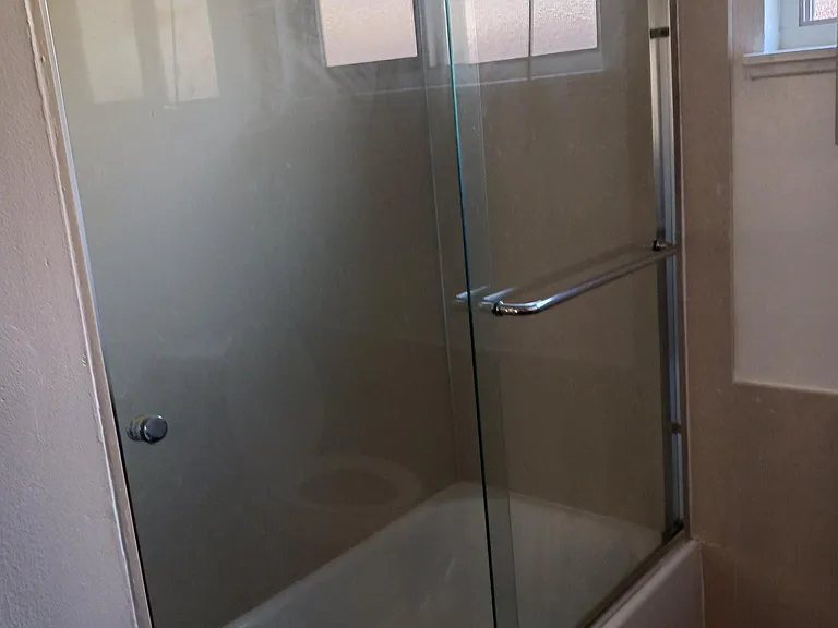 This is the bathroom that has a shower and bathtub.
