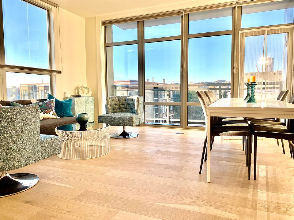 living room and dining room, lots of natural light. Private patio/balcony though door on right side.