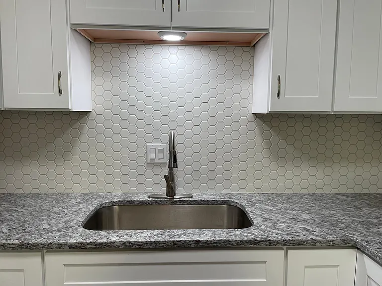 Kitchen, completely updated with modern cabinets, granite counter tops, beautiful ceramic tile backsplash, etc.
