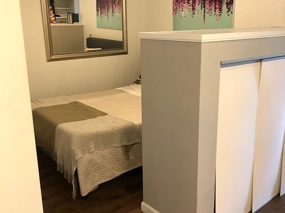 Cozy room will comfortably fit a queen bed with nightstands