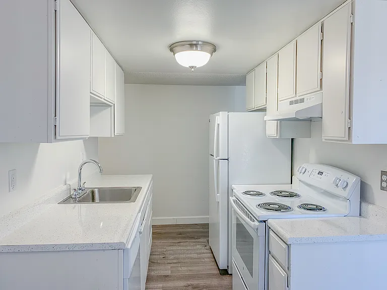 One bedroom apartment kitchen with granite countertops