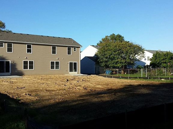 REAR EXTERIOR (UNIT NOW HAS GRASS)