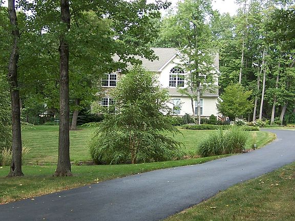 View from the end of the driveway, across the landscaped creek