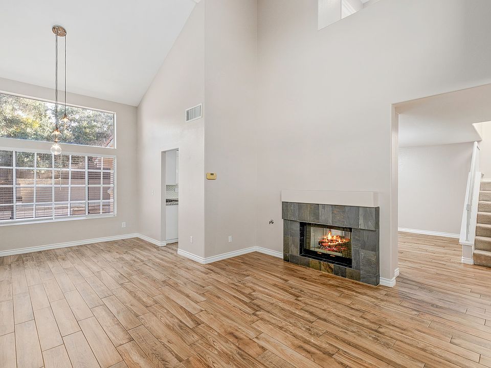 Family and Dining area, high ceilings with double sided fireplace