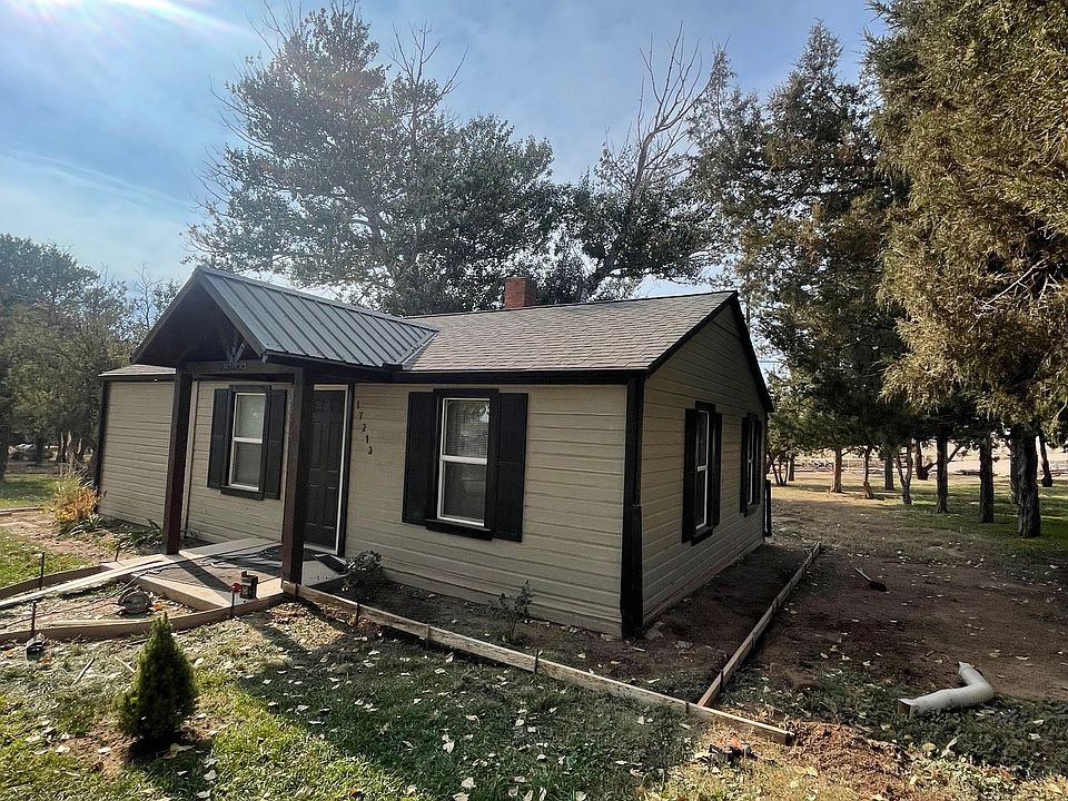 Front of house with view of soon-to-be added porch and walkway