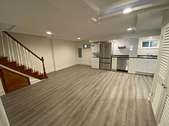 Living room space next to kitchen. This room has its own HVAC wall unit with remote control. There is also a washer/dryer.